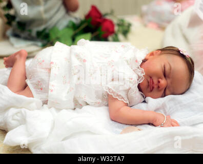 Layton, Utah, USA. 11th July, 2019. A reborn baby doll is displayed in the contest hall at the 6th Annual R.O.S.E International Doll Expo, a showcase for ultra realistic ''reborn'' baby dolls. Fashioned meticulously from viny and silcone, and weighted with glass beads and other materials for maximum realism, these collectible dolls have also been employed as emotional, cuddle therapy for dementia patients. Credit: Brian Cahn/ZUMA Wire/Alamy Live News Stock Photo