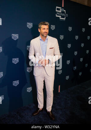 Actor and racing driver Patrick Dempsey signs autographs during the ...