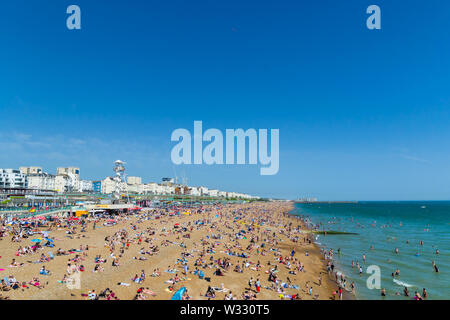 UK June 29th, 2019 Brighton beach, Brighton and Hove, East Sussex, England. Thousands of people relax on the sun.