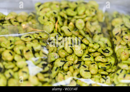 Packages of roasted green soybeans soy edamame with wasabi and seaweed in Tsukiji outer street fish market in Ginza Tokyo, Japan Stock Photo