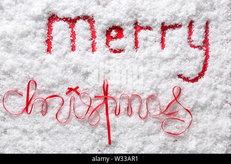 Text MERRY CHRISTMAS on snow Stock Photo