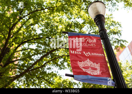 Little Rock, USA - June 4, 2019: Street sign on lamp post in summer of Miss Arkansas Pageant scholarship advertisement for beauty competition Stock Photo