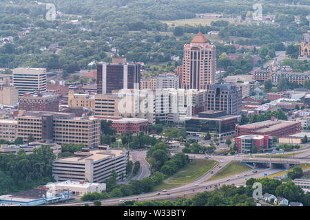 Roanoke, USA - June 1, 2019: Aerial cityscape downtown view on city in Virginia with business buildings and mountains highway Stock Photo