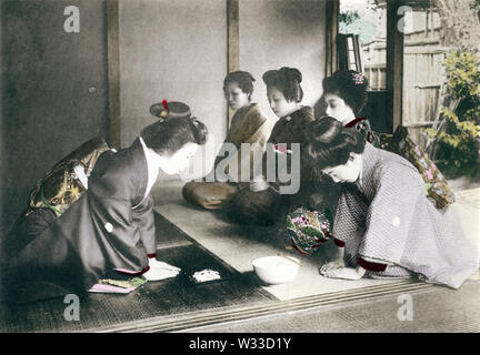 [ 1900s Japan - Japanese Tea Ceremony ] —   Tea Ceremony: Presenting sweets. This image comes from “The Ceremonial Tea Observance in Japan,” published in 1907 (Meiji 40) by photographer Kozaburo Tamamura, and later by Teijiro Takagi.  8 of 14  20th century vintage collotype print. Stock Photo