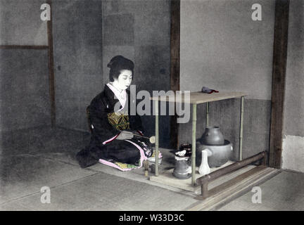 [ 1900s Japan - Japanese Tea Ceremony ] —   Tea Ceremony: Preparing tea. This image comes from “The Ceremonial Tea Observance in Japan,” published in 1907 (Meiji 40) by photographer Kozaburo Tamamura, and later by Teijiro Takagi.  9 of 14  20th century vintage collotype print. Stock Photo