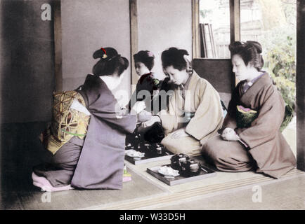 [ 1900s Japan - Japanese Tea Ceremony ] —   Tea Ceremony: Having dinner. This image comes from “The Ceremonial Tea Observance in Japan,” published in 1907 (Meiji 40) by photographer Kozaburo Tamamura, and later by Teijiro Takagi.  12 of 14  20th century vintage collotype print. Stock Photo