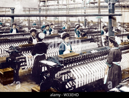 [ 1900s Japan - Japanese Cotton Spinning Factory ] —   Young women in Western style uniforms working at a large cotton spinning factory.  20th century vintage glass slide. Stock Photo