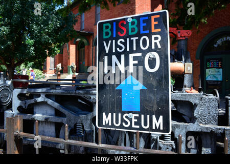A sign for Bisbee Visitor Info and Bisbee Mining and Historical museum in small town America, the old mining town of Bisbee, AZ Stock Photo