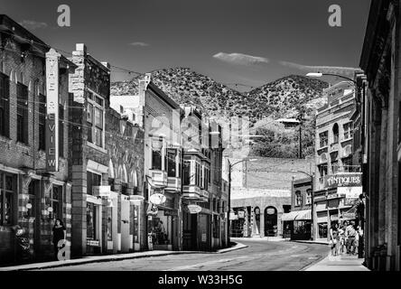 People enjoy the sites, the cafes, and shopping, in the histoic old mining town in classic small town America, Bisbee, AZ, USA in black and white Stock Photo