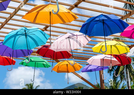 Street decorated with colored umbrellas, island Koh Phangan, Thailand. Hanging colorful umbrellas, on the outdoors Stock Photo