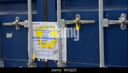 indian ocean, international waters - december 29, 2014: an indonesian  customs seal at the doors of a container stowed on deck of the container vessel Stock Photo