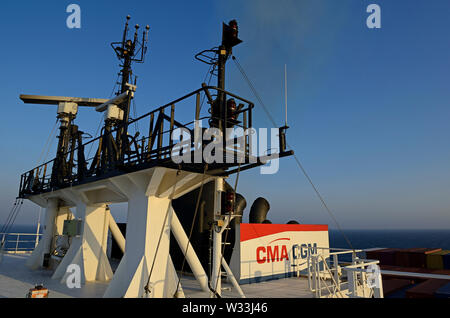 red sea, international waters - january 03, 2015: funnel and monkey island with antennas of container vessel cma cgm vela (imo  9354923) Stock Photo