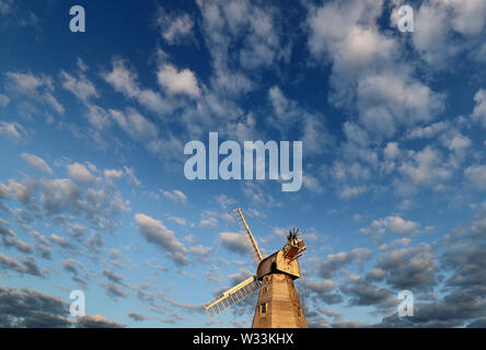 A view of Willesborough Windmill, a restored and working white smock mill built in 1869 in Ashford, Kent, during the morning sunlight. Stock Photo