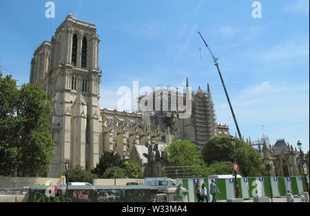 10 July 2019, France, Paris: The partially scaffolded cathedral of Notre-Dame. Three months ago a devastating fire had partially destroyed the cathedral on 15.04.2019. Photo: Julia Naue/dpa Stock Photo