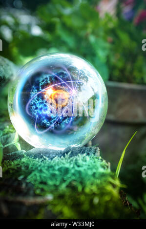 Magic crystal ball atom in nature for summer fantasy imagery Stock Photo