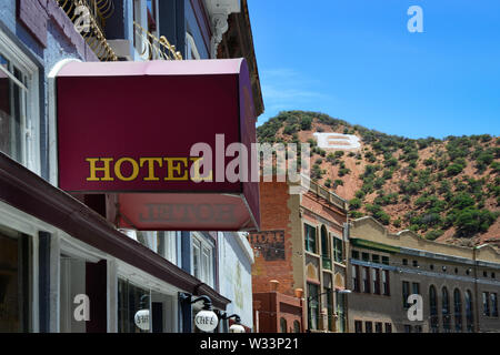 The 'B' on Chihuahua Hill overlooks historic buildings and hotels in the old mining town of Bisbee, AZ, Stock Photo