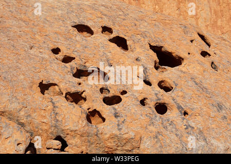 Close Up of Sunlit Uluru Rock Holes Stock Photo