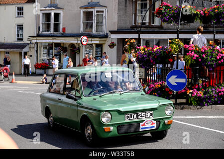 The 2019 Carnival procession in  Thornbury south Gloucestershire UK A 1965 Hillman Imp de Luxe Stock Photo