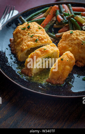 Russian cuisine stuffed chicken cutlets kiev-style with butter sauce Stock Photo