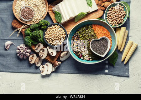 Healthy food for vegans and vegetarian.  Grains, seeds, nuts, vegetables, tofu. Food high in antioxidants, plant protein, dietary fiber Stock Photo