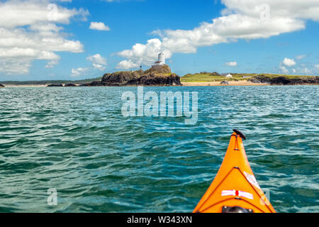 Approaching Ynys Llanddwyn or Llanddwyn Island by sea kayak. West coast of Anglesey, North Wales,UK Stock Photo