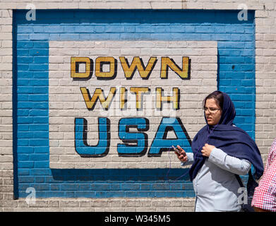 Tehran, Iran. 16th Apr, 2017. 16.04.2017, Iran, Tehran: An anti-America mural 'Down with USA' on the outer wall of the former US Embassy in the center of the Iranian capital Tehran, recorded on 16.04.2017. It was occupied by Iranian students in 1979 during the Islamic Revolution, and 52 Americans were held hostage for 444 days. Today, the building houses a museum. Credit: Thomas Schulze/dpa-Zentralbild/ZB | usage worldwide/dpa/Alamy Live News Stock Photo