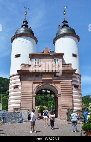 Heidelberg, Germany - June 2019: Gate to old 'Karl Theodor' bridge over the Neckar river in city center after restauration on a sunny day Stock Photo