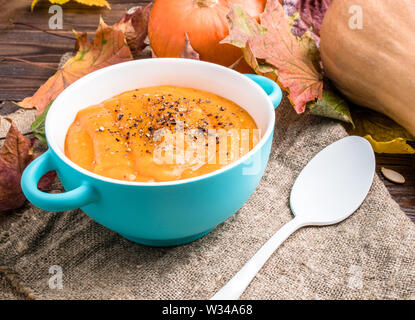 Image of useful soup of pumpkin puree on linen fabric Stock Photo