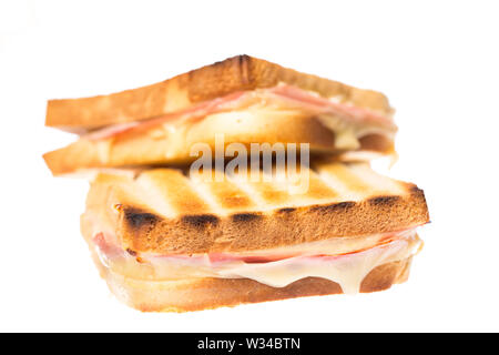 Two ham cheese toasts on each other on white background Stock Photo