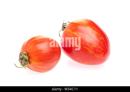 2 tomatoes 'Shimmeig Creg' in front of white background Stock Photo