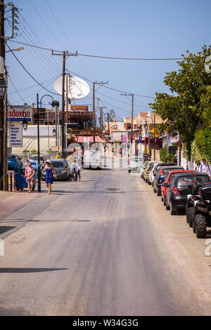 Malia, Crete, Greece - May 27, 2019. Daytime view of the street in Malia Stock Photo