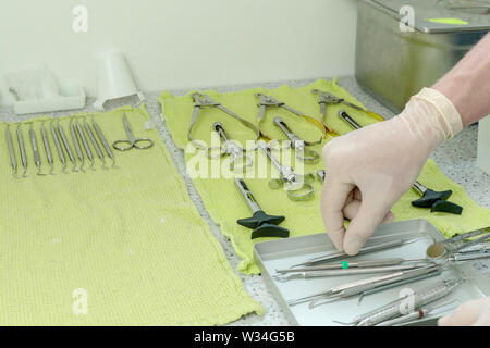 Preparation of surgical instruments. Dental instruments are tools that dental professionals use to provide dental treatment. Close up view Stock Photo