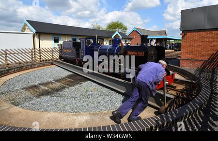 Blickling Hall Narrow Gauge Steam Train on the turntable being push around at Wroxham Station on the Bure Valley Railway Norfolk. Stock Photo