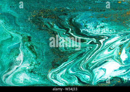 Liquid uneven green marbling pattern with glare of light Stock Photo