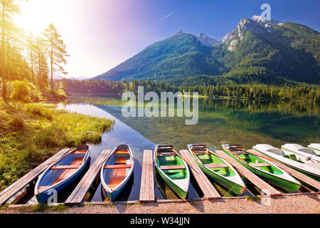 Colorful boats on Hintersee lake in Berchtesgaden Alpine landscape sunrise view, Bavaria region of Germany Stock Photo