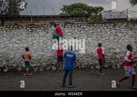 June 14, 2019 - Goma, Democratic Republic of Congo - Former child soldiers play soccer at the Transit Centre in Goma..Hundreds will spend several months here before being reintegrated into the community. UNICEF is working with MONUSCO (UN DRC stabilization mission) to support some of the tens of thousands of child soldiers that have been recruited in eastern DRC since 2013. (Credit Image: © Sally Hayden/SOPA Images via ZUMA Wire) Stock Photo