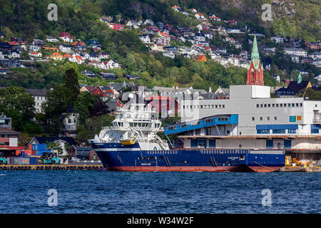 Offshore PSV fire fighting, stand-by vessel Island Dragon in the port of Bergen, Norway. Stock Photo