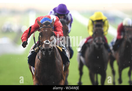 Veracious ridden by jockey Oisin Murphy (left) on their way to victory in the Tattersalls Falmouth Stakes during day two of the Moet and Chandon July Festival 2019 at Newmarket Racecourse. Stock Photo