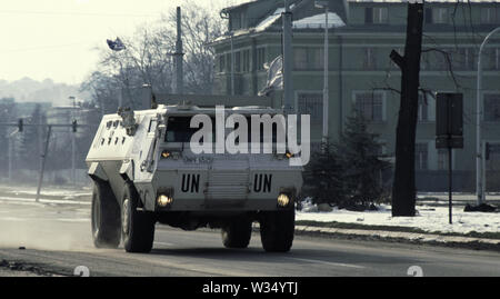 2nd April 1993 During the Siege of Sarajevo: a United Nations Egyptian Fahd APC (Armoured Personnel Carrier) drives east along 'Sniper Alley', close to the Holiday Inn. Stock Photo