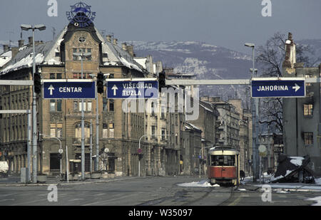 2nd April 1993 During the Siege of Sarajevo: a wrecked tram lies abandoned at the end of 'Sniper Alley' where the old town of Sarajevo begins. Stock Photo
