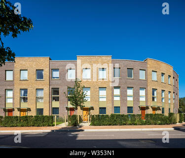 View across street towards curved urban blocks. Kidbrooke Village Phase 5, Kidbrooke, United Kingdom. Architect: CZWG Architects LLP, 2019. Stock Photo