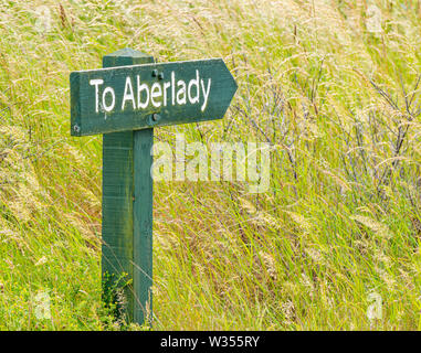 Wooden signpost pointing the way to Aberlady, Aberlady Nature Reserve, East Lothian, Scotland, UK Stock Photo