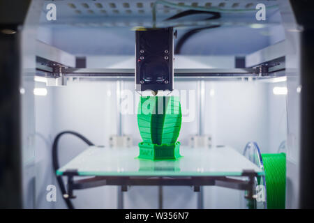 Three dimensional printing machine prints physical 3D model Stock Photo