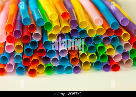 Pile of colorful plastic drinking straws. Close up image. Stock Photo