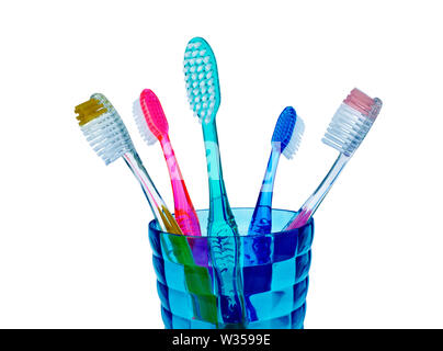 Tooth brushes in a glass isolated on white Stock Photo