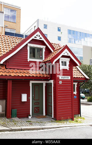 A traditional red wooden Norwegian house on Tempelkroken in the neighborhood of Nøstet in Bergen, Norway. Stock Photo