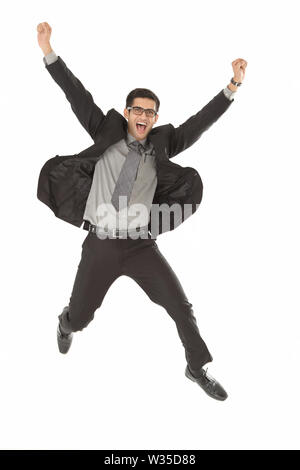 Portrait of a businessman running and smiling Stock Photo