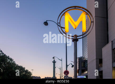 Illuminated metro sign at dusk, Bastille, Paris, France. Stock Photo