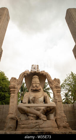 Ugra Narsimha or Lakshmi Narsimha temple at Hampi. The man-lion avatar of Lord Vishnu - seated in a yoga position Stock Photo