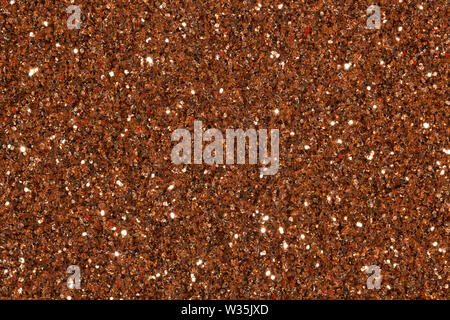 Brown glitter background with glow. High quality texture in extremely high resolution. Stock Photo